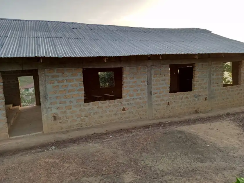 Side view of the church building with zinc roof