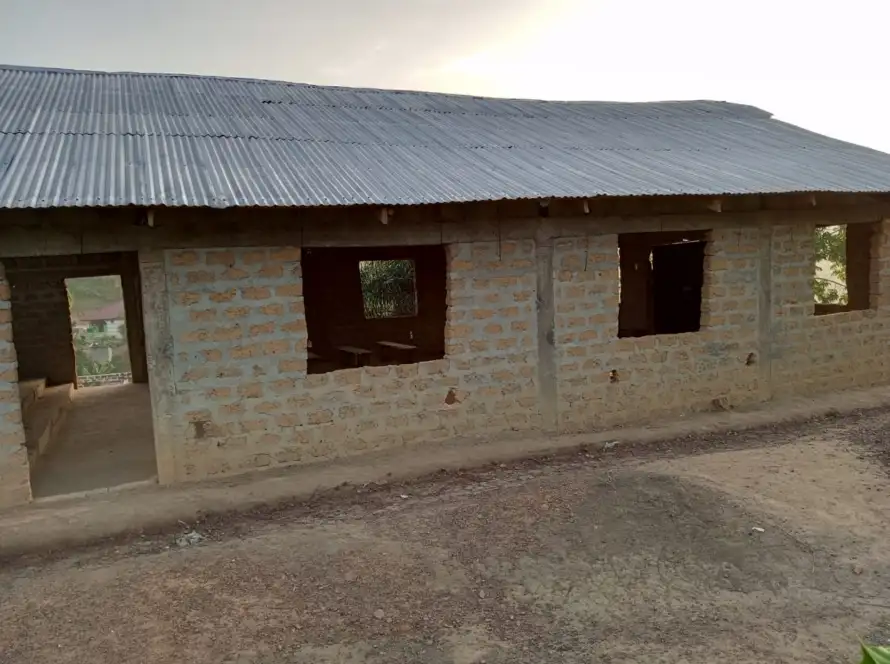 Side view of the church building with zinc roof