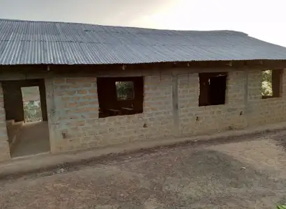 Side view of the church building with zinc roof